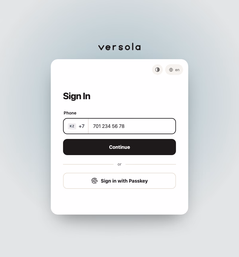 The phone sign-in screen in the default theme: the Versola wordmark above the card, the phone field with a country code and the passkey button